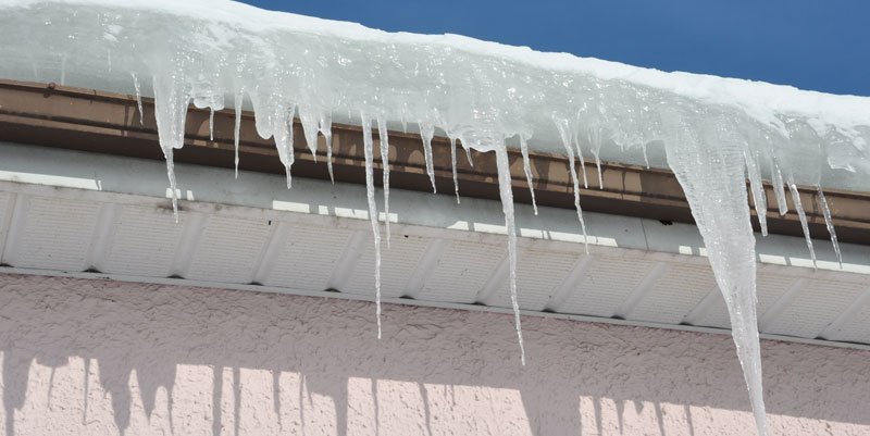Icicles forming on side of roof