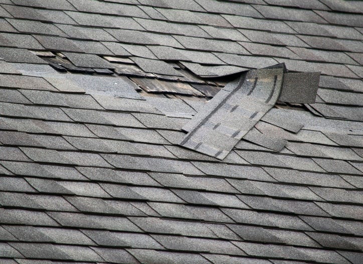 Damaged asphalt roof.