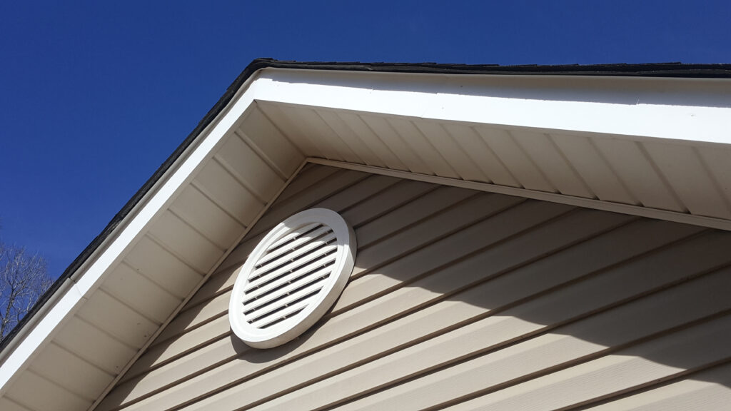 Closeup of a gable vent on a house.